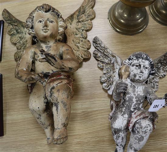 Two 19th century Continental polychrome wood cherubs tallest 52cm